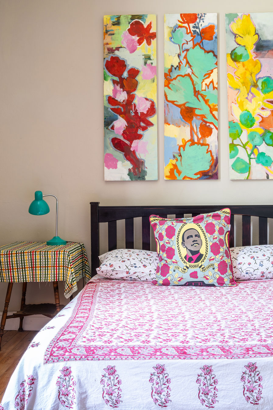 Colourful bedroom with a mix of bold patterns and graphic, illustrative fabrics