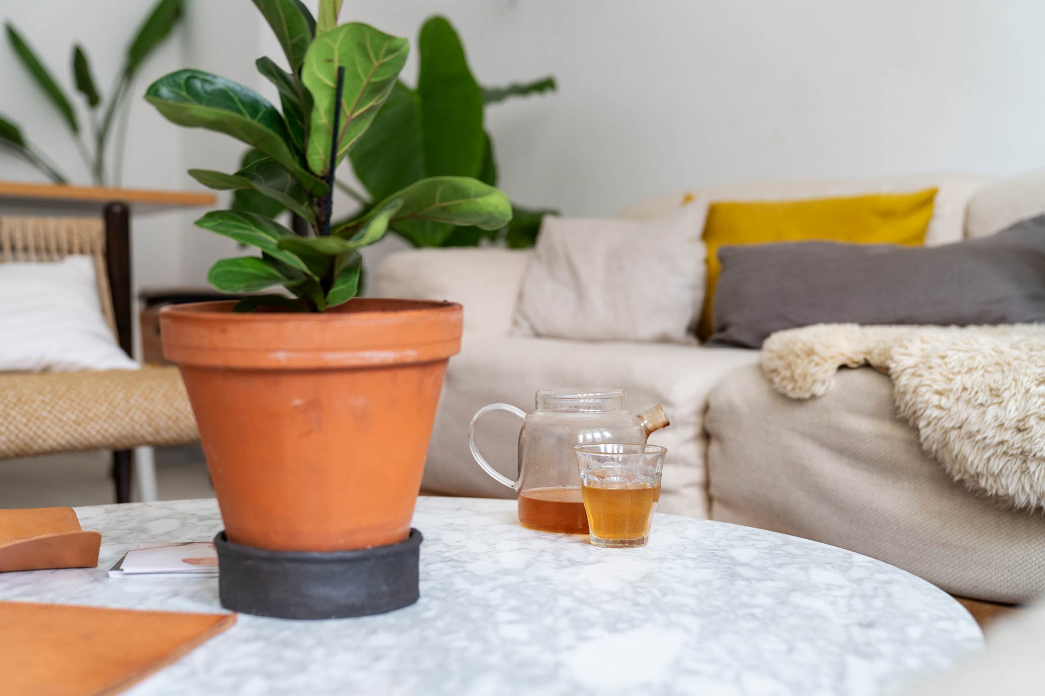 A tea canister of a marble table